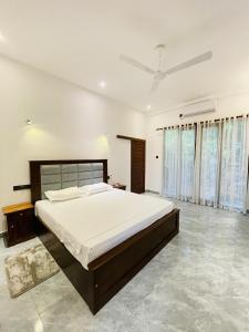 Postel nebo postele na pokoji v ubytování Harmon Weligama