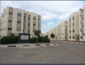 an empty parking lot in front of a large building at Gravereau in Oujda +1 photo