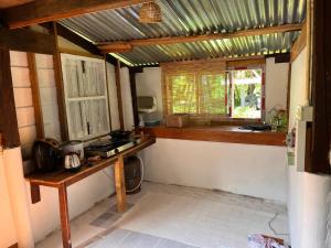 a kitchen with a counter and a window in it at Balance home happy in Ban Laem Sai