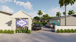 une maison avec une voiture garée sur un parking dans l'établissement Trishvam Palolem Beach Resort, à Canacona 10 autres photos