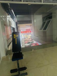 a glass window with a view of a street at AZURE stay happy in Pudunagaram