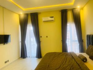 Ένα ή περισσότερα κρεβάτια σε δωμάτιο στο Lanosa Stay, Wuye