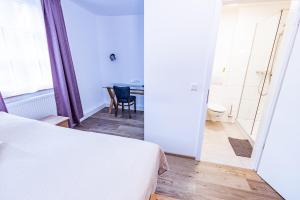 Postel nebo postele na pokoji v ubytování Gasthaus Alte Post