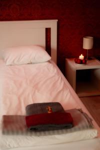 Postel nebo postele na pokoji v ubytování Konrad Family Guesthouse