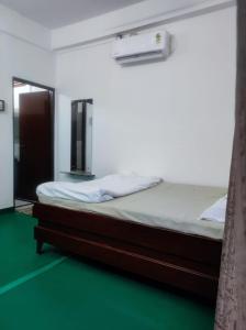 Ένα ή περισσότερα κρεβάτια σε δωμάτιο στο GoFam