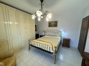 Ένα ή περισσότερα κρεβάτια σε δωμάτιο στο Appartamento Urban Daisy +2 φωτογραφίες