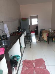 a kitchen with a sink and a counter top at Suíte no cidade Jardim in Parauapebas +7 photos