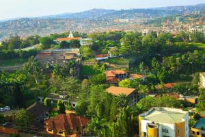 an aerial view of a town with houses and trees at Myra Luxury Homes in Kololo- Your Family Oasis in Kampala