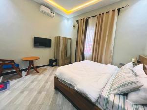 Ένα ή περισσότερα κρεβάτια σε δωμάτιο στο ES Apartments