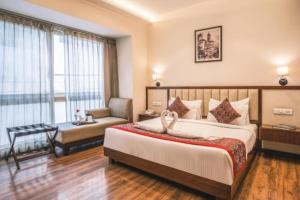 Ένα ή περισσότερα κρεβάτια σε δωμάτιο στο Hotel The Gross Infinity Near Delhi Airport