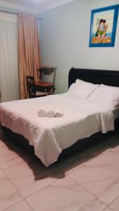 Ένα ή περισσότερα κρεβάτια σε δωμάτιο στο EL Golfview