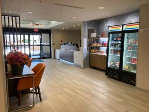 a store with a table and chairs and a counter at Holiday Inn Express and Suites Winchester by IHG in Winchester