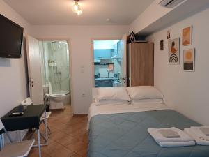 Postel nebo postele na pokoji v ubytování Despina's sweet studio -FREE PARKING- close to panthessaliko stadium and public pool of Nea Ionia