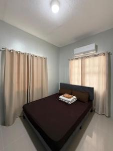 Postel nebo postele na pokoji v ubytování Kamayo Guest House -near Dahican beach + 15 fotografií