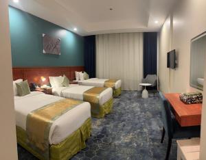 Postel nebo postele na pokoji v ubytování فندق برهان الضيافة + 6 fotografií