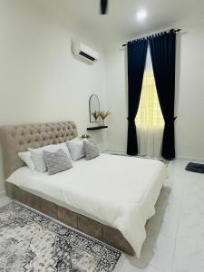 Postel nebo postele na pokoji v ubytování The Payong House