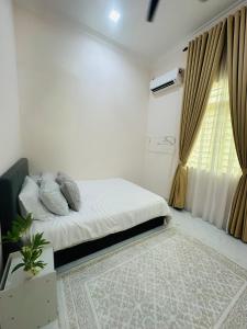 Postel nebo postele na pokoji v ubytování The Payong House + 9 fotografií