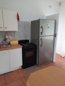 Kuchyň nebo kuchyňský kout v ubytování Sea shells self catering