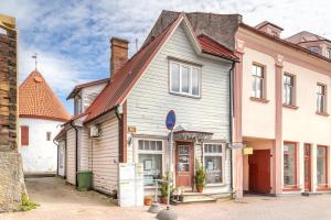 a large house with a brown roof at Old town apartment in Pärnu