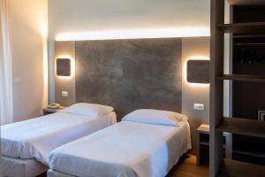 Postel nebo postele na pokoji v ubytování Hotel Meeting + 49 fotografií