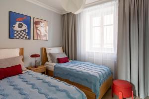 Ένα ή περισσότερα κρεβάτια σε δωμάτιο στο Red Roof Apartments Old Town