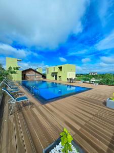a swimming pool on the roof of a building at Manthila Hotel in Anuradhapura