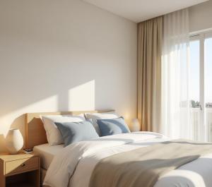 Ένα ή περισσότερα κρεβάτια σε δωμάτιο στο Benpa Hotel