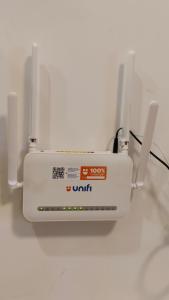 ein weißer Router auf einer weißen Wand in der Unterkunft Superb hotel apartment in Gelang Patah