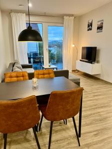 Μια τηλεόραση ή/και κέντρο ψυχαγωγίας στο Moderne Wohnung in Heskem bei Marburg (Lahn)