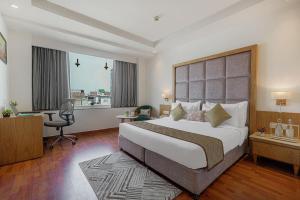Ένα ή περισσότερα κρεβάτια σε δωμάτιο στο Hotel TuLip Near Delhi Airport,A block road no 4 street no 10 mahipalpur new delhi +7 φωτογραφίες
