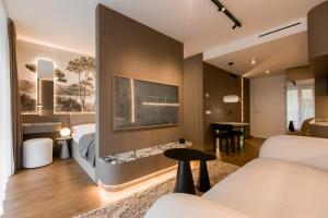 En eller flere senge i et værelse på Bohéme apartmán v srdci Bratislavy