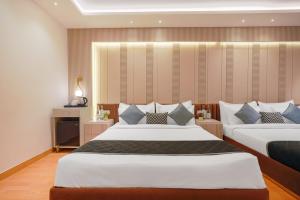 Ένα ή περισσότερα κρεβάτια σε δωμάτιο στο Hotel TuLip Near Delhi Airport,A block road no 4 street no 10 mahipalpur new delhi