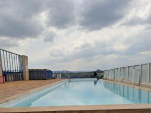 a swimming pool on the roof of a building at Deslly Afrika Stays in Kiambu