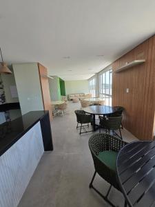a room with a table and chairs and a room with tables at Polo NEXT Studios in Volta Redonda +26 photos