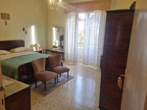 Ένα ή περισσότερα κρεβάτια σε δωμάτιο στο Il Ducale Apartments