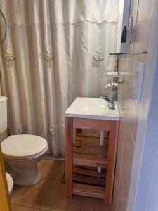 a bathroom with a sink and a toilet at Las Grutas Star in Las Grutas +16 photos