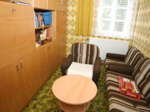 a living room with two chairs and a table at Holiday Home in Scheifling near Ski Slopes in Scheifling