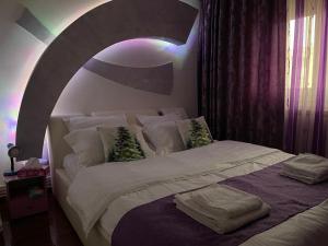 Postel nebo postele na pokoji v ubytování Cosy Home Apartament