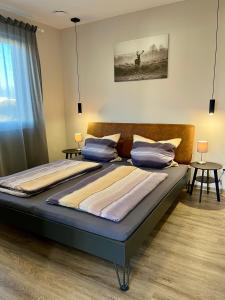 Ένα ή περισσότερα κρεβάτια σε δωμάτιο στο Moderne Wohnung in Heskem bei Marburg (Lahn) +10 φωτογραφίες