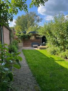 Zahrada ubytování Diedjestee + 4 fotografie