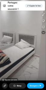 Postel nebo postele na pokoji v ubytování Résidence des deux palmiers