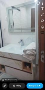 Koupelna v ubytování Résidence des deux palmiers