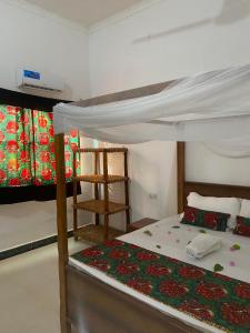 Postel nebo postele na pokoji v ubytování Uzuri house