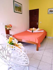 Ένα ή περισσότερα κρεβάτια σε δωμάτιο στο Miracle des Caraibes