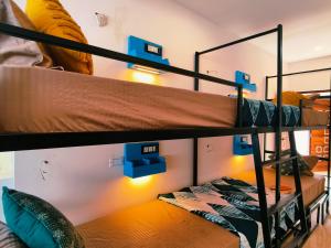 a bunk bed room with two bunk beds at Mitra Palolem in Canacona +10 photos