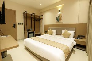 Postel nebo postele na pokoji v ubytování M Square Express