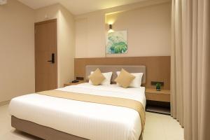 Postel nebo postele na pokoji v ubytování M Square Express