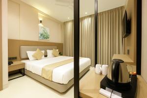 Postel nebo postele na pokoji v ubytování M Square Express