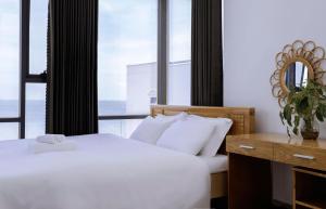 Ένα ή περισσότερα κρεβάτια σε δωμάτιο στο The July - Coliving by Kegotel