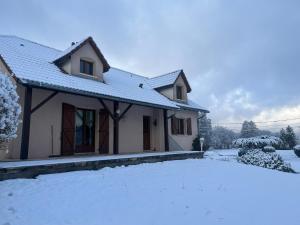a house with snow in front of it at Nouveau, gîte RDVosges 5 chambres, jardin, calme, proche GERARDMER in Ban-sur-Meurthe-Clefcy